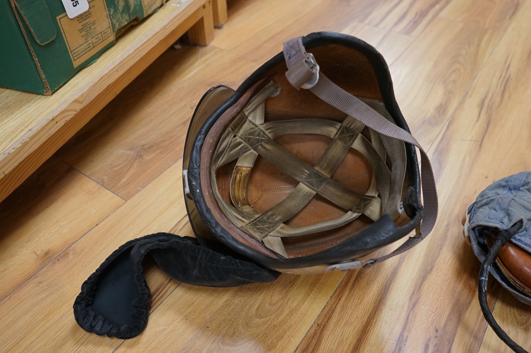 A Sykes-Fairburn Fighting Knife by Wilkinson sword in its leather scabbard, together with a 1942 Mk.III military compass by T.G.Co.Ltd. in a webbing pouch dated 1940, together with another compass, a telescope in a leath